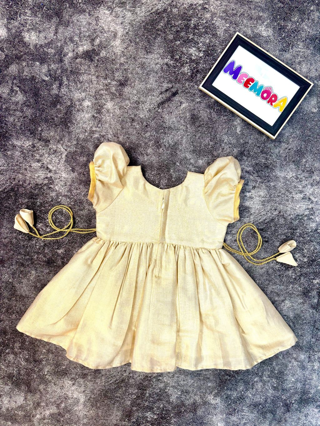 Cream Kasavu Kerala traditional frock for kids, festive Onam wear close-up
