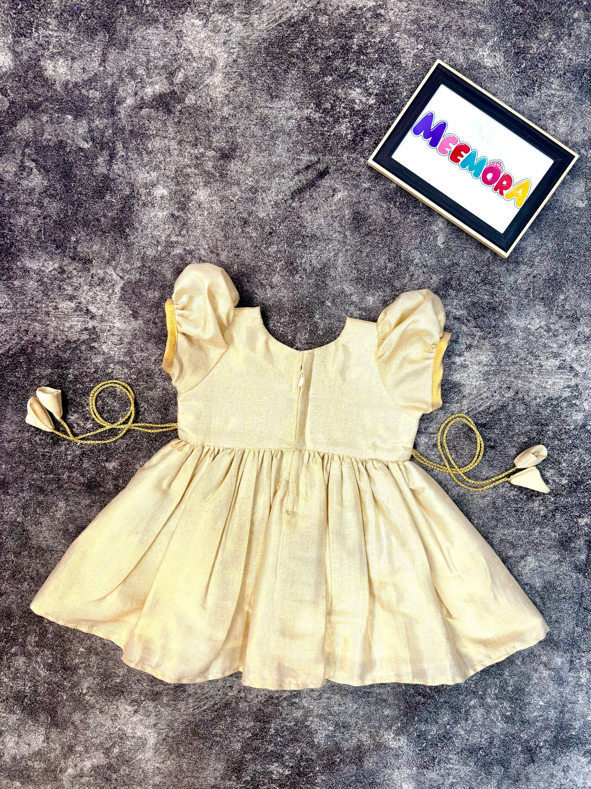 Cream Kasavu Kerala traditional frock for kids, festive Onam wear close-up