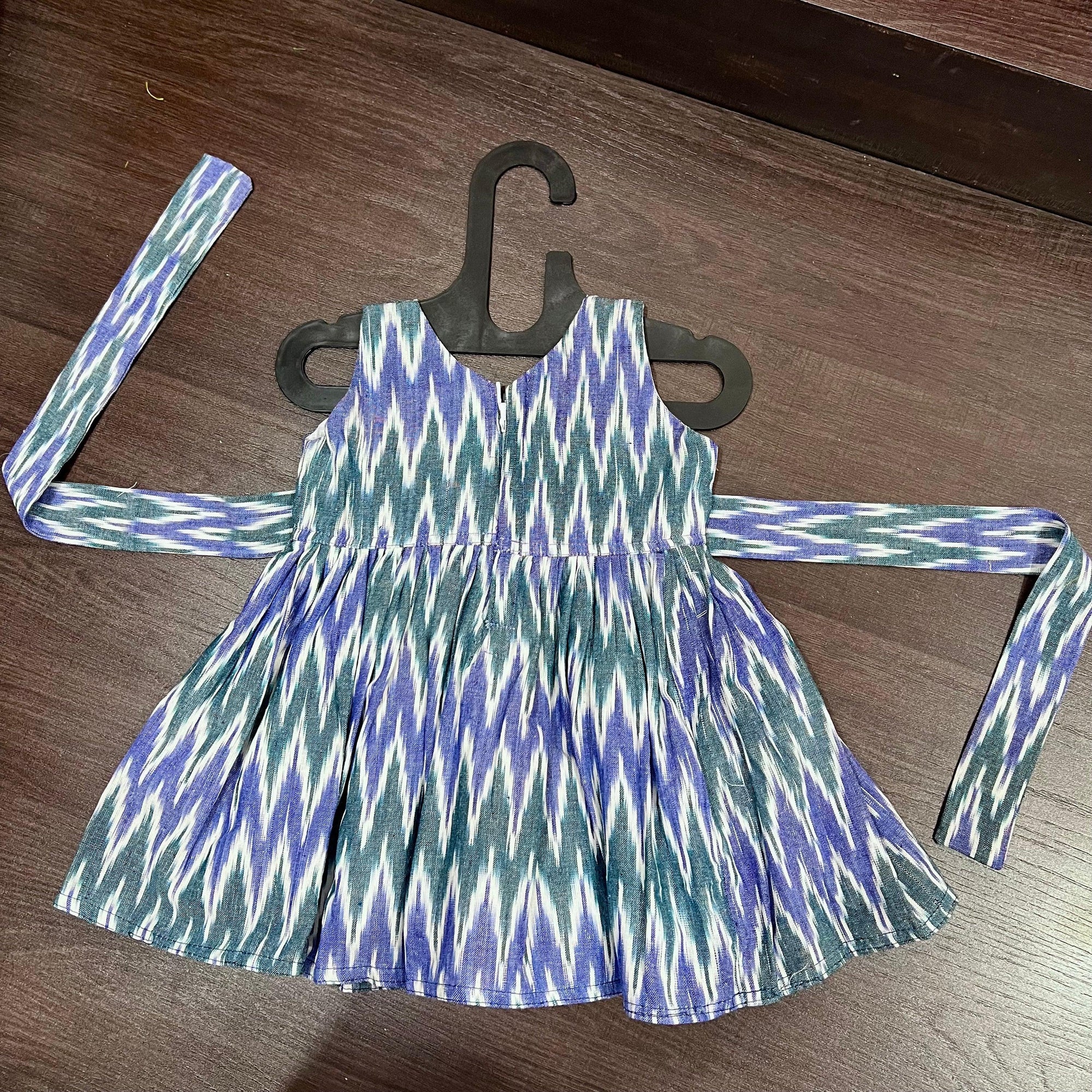 Light blue and green ikat cotton frock for girls - back view